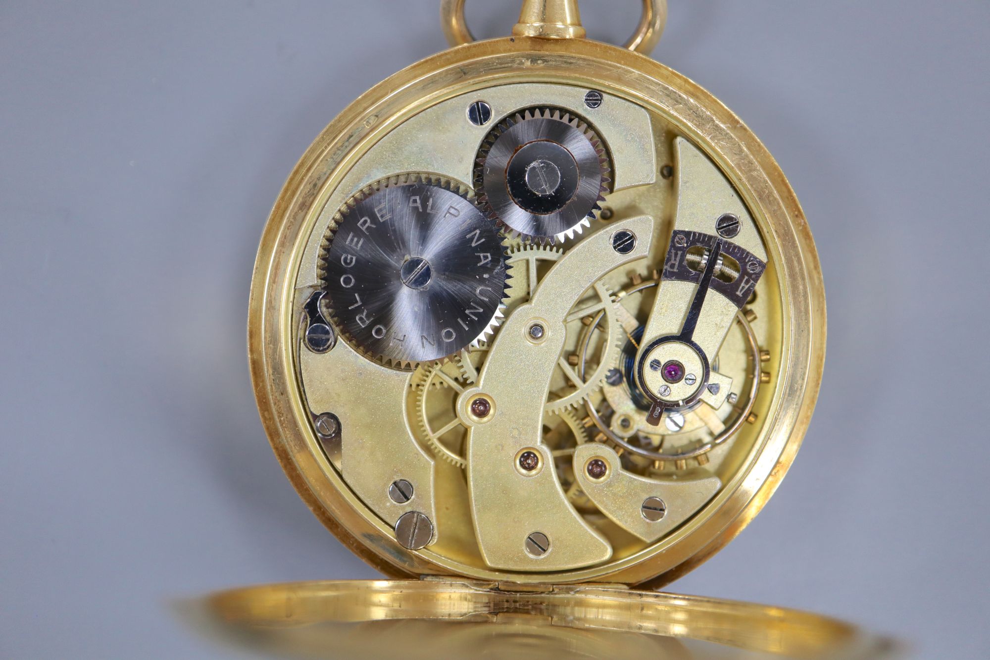 A continental 18k yellow metal open face pocket watch, with Arabic dial and subsidiary seconds,